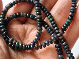 4.5-5mm Black Ethiopian Welo Opal Faceted Rondelle Beads, 4 Inch Natural Fire